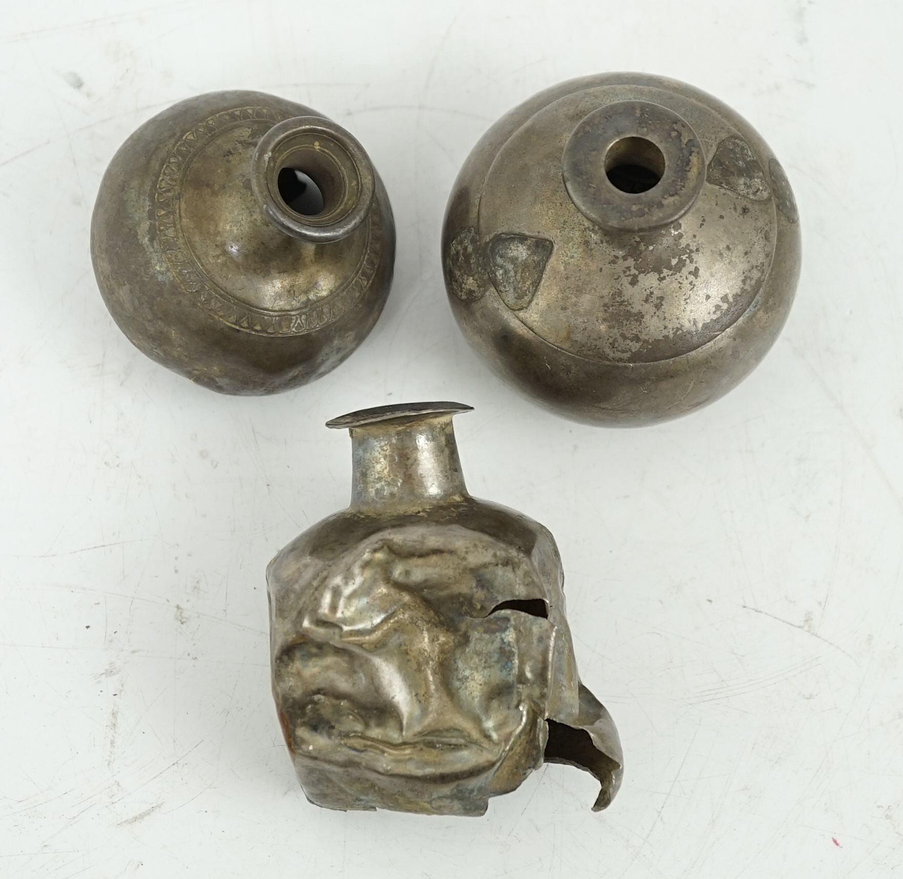 Three silver aryballoi, incomplete, Roman or Gandhara, c. late 1st century BC - early 1st century A.D.